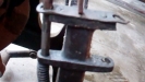 Broken roller hook arm close up